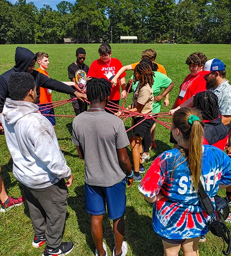 Kids at a CTI Conference in team building exercise